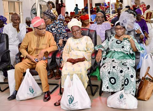 Elderly attendees with Mercy Hands care packages