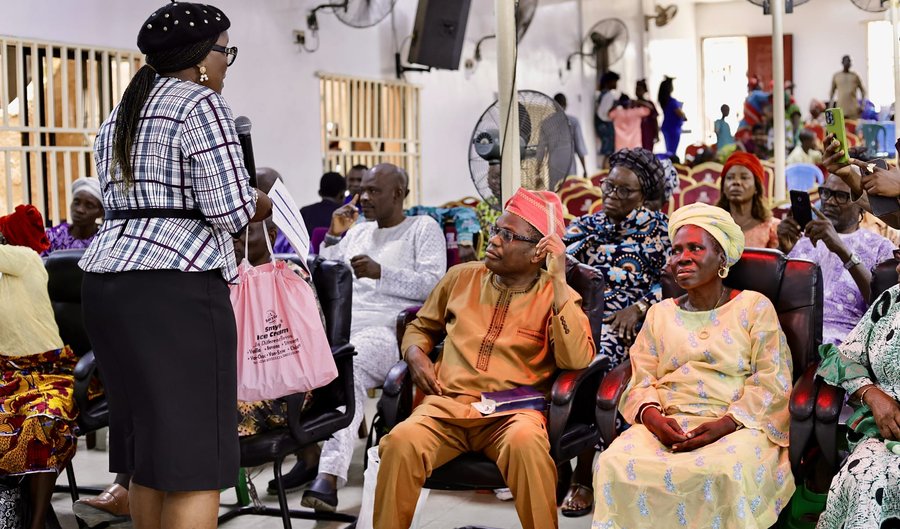 Mercy Hands volunteer engaging with elderly attendees