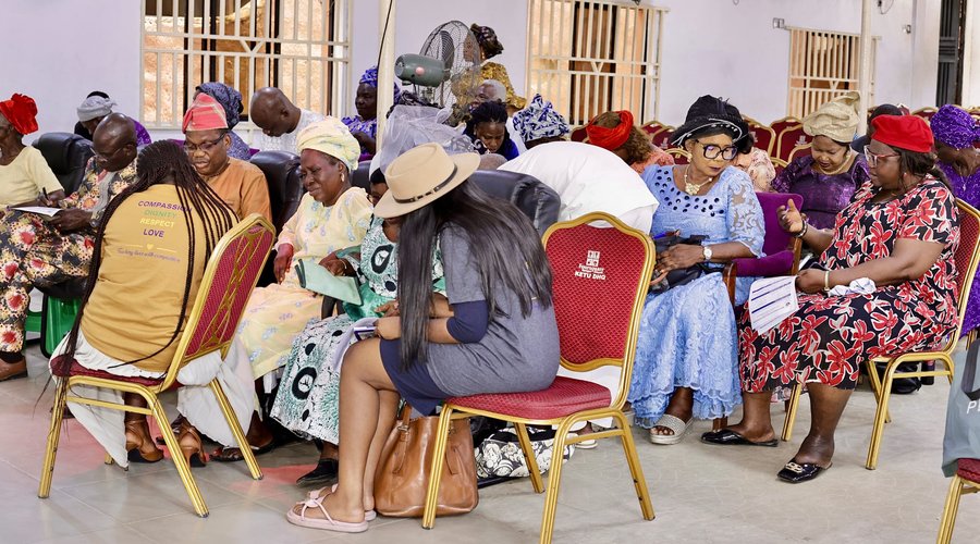 Elderly attendees seated together at a Mercy Hands outreach event
