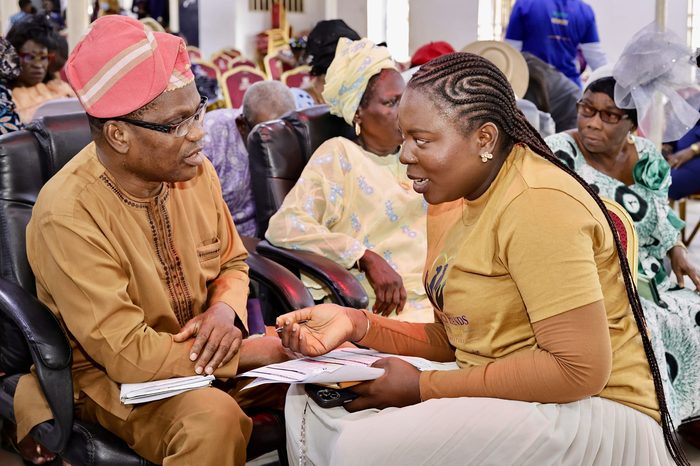 Mercy Hands team member speaking with an elderly attendee