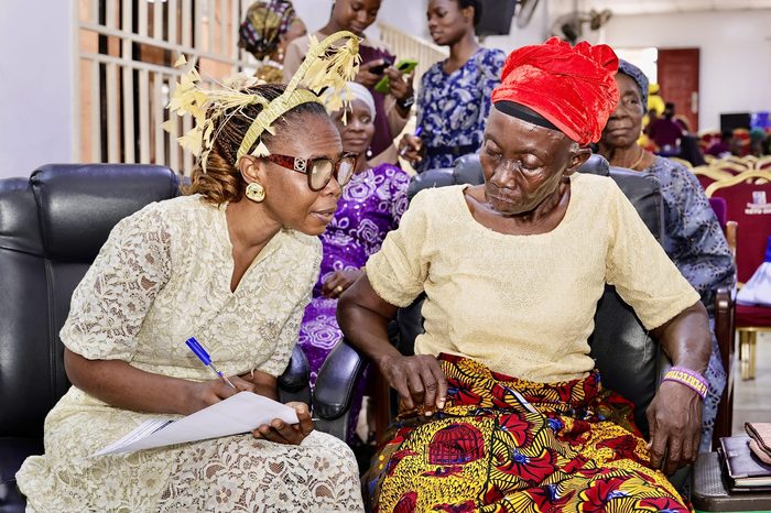 Mercy Hands volunteer assisting an elderly woman